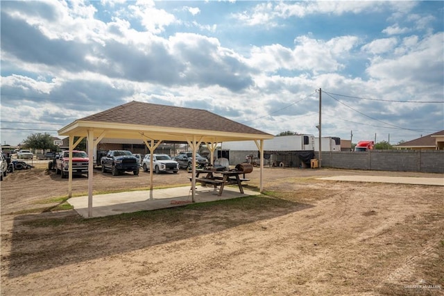 view of parking featuring fence