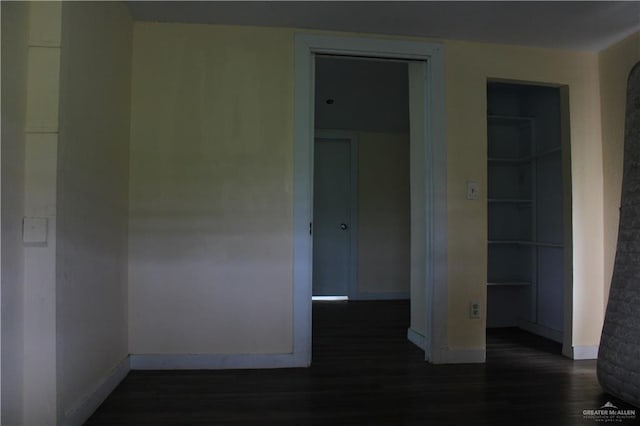 empty room featuring dark hardwood / wood-style flooring