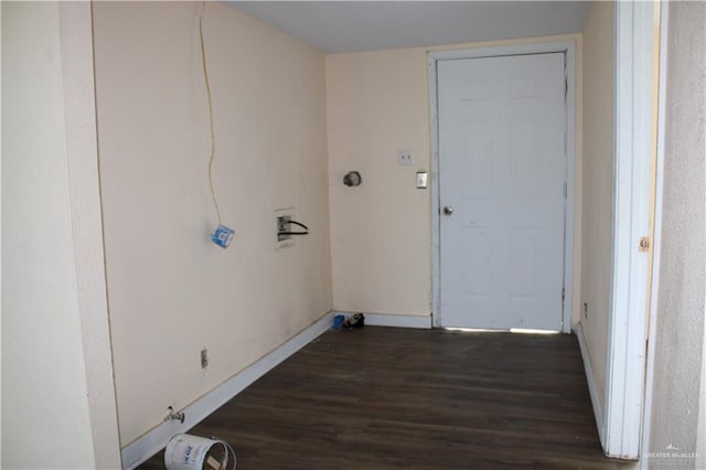 laundry area with dark hardwood / wood-style flooring