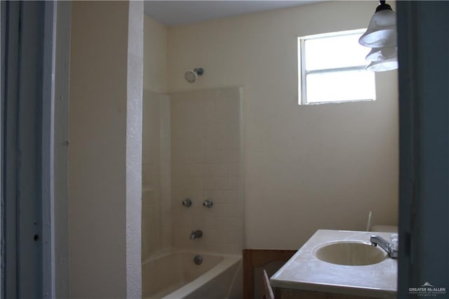 bathroom with vanity and bathtub / shower combination