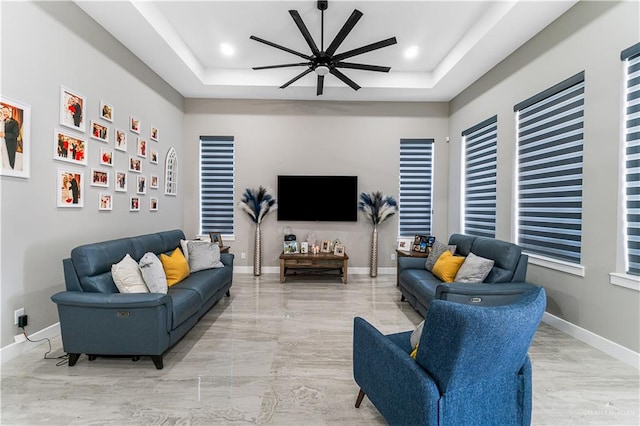 living room featuring a tray ceiling