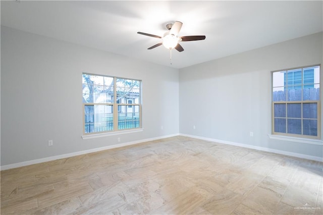 spare room with ceiling fan