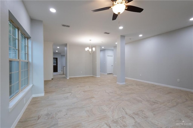 interior space with ceiling fan with notable chandelier