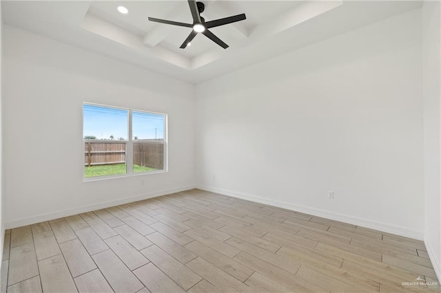 2413 N Gaytan Ave, Edinburg, TX 78542 - empty room with a raised ceiling, light wood-type flooring, a ceiling fan, baseboards, and recessed lighting