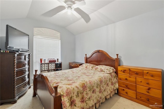 carpeted bedroom featuring ceiling fan and lofted ceiling