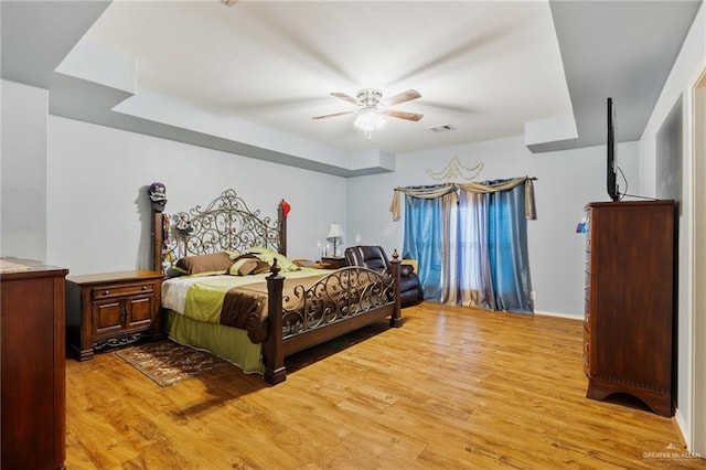 bedroom with ceiling fan and light wood-type flooring