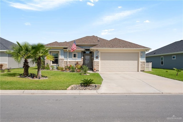 view of front facade featuring a front yard and a garage