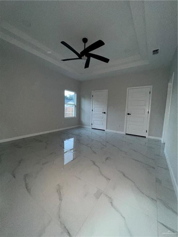 409 S 12th St, Alamo, TX 78516 - unfurnished room with baseboards, marble finish floors, and a ceiling fan