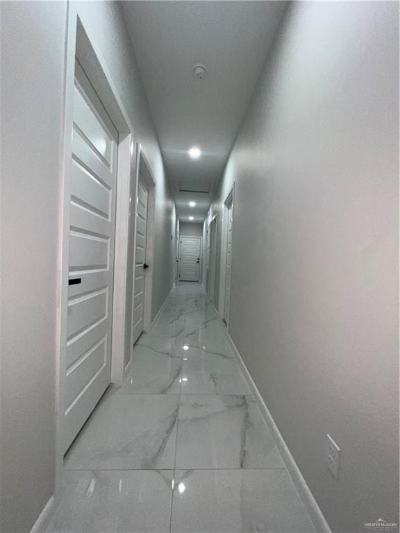 409 S 12th St, Alamo, TX 78516 - corridor with baseboards and marble look tiles