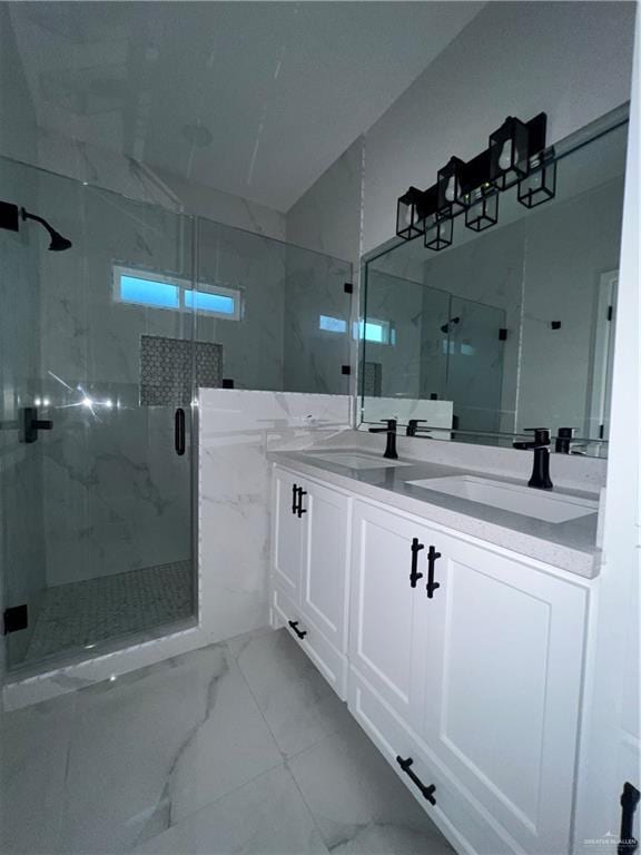 409 S 12th St, Alamo, TX 78516 - bathroom with marble look tiles, a marble finish shower, and double vanity