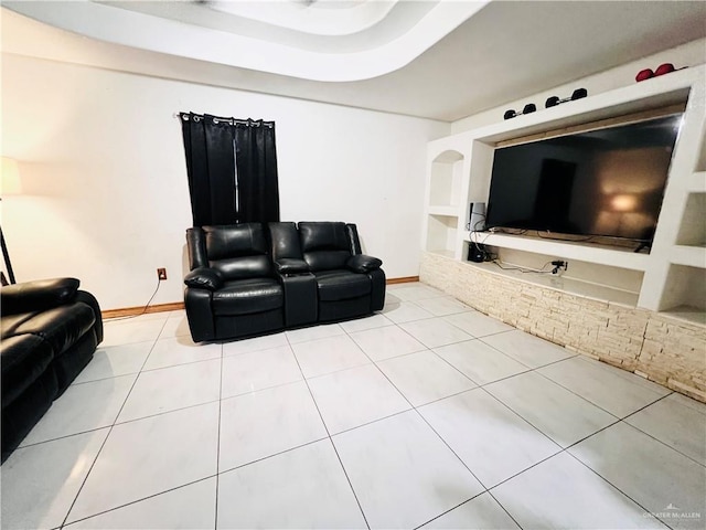 living room featuring built in shelves and light tile patterned flooring