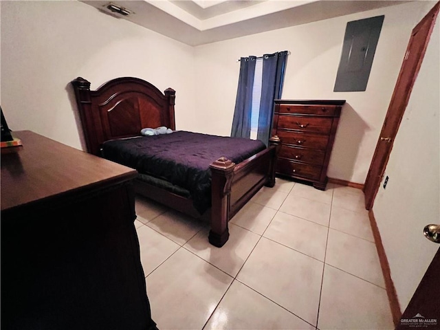 bedroom featuring light tile patterned floors and electric panel