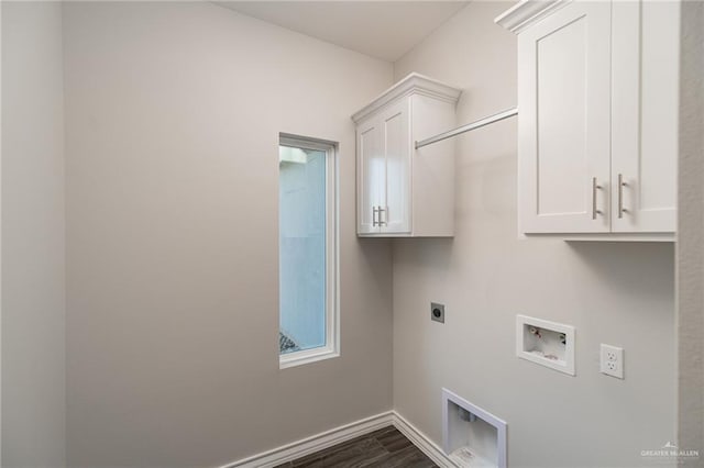 laundry area with washer hookup, cabinet space, dark wood-type flooring, electric dryer hookup, and baseboards