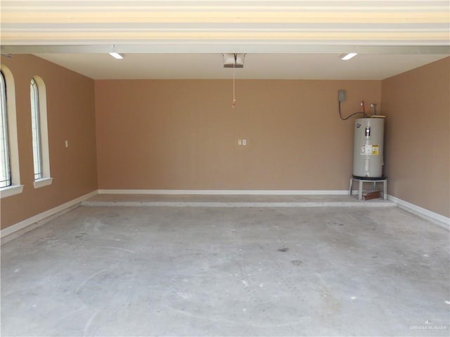 5421 San Diego Dr, Edinburg, TX 78542 - garage featuring electric water heater, baseboards, and a garage door opener