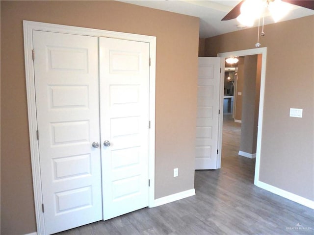 5421 San Diego Dr, Edinburg, TX 78542 - unfurnished bedroom featuring baseboards, wood finished floors, a closet, and a ceiling fan