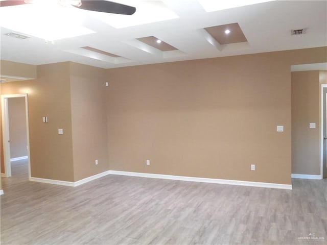 5421 San Diego Dr, Edinburg, TX 78542 - spare room featuring light wood-type flooring, baseboards, and coffered ceiling