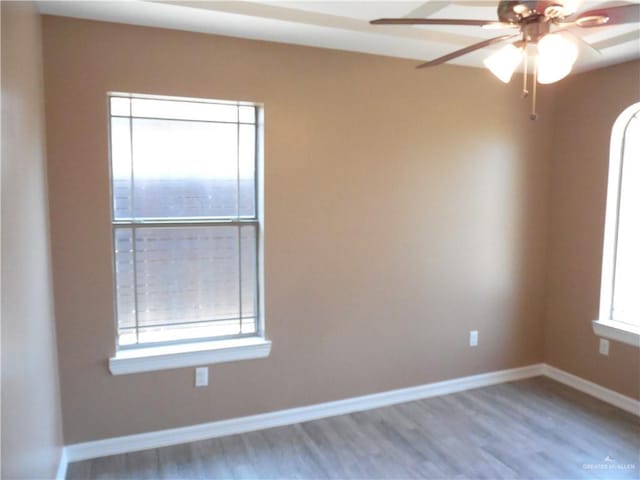 5421 San Diego Dr, Edinburg, TX 78542 - spare room featuring wood finished floors, a ceiling fan, and baseboards