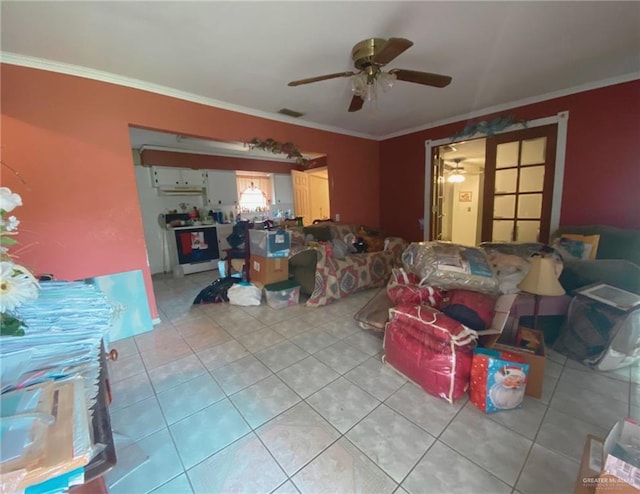 living room featuring visible vents, ornamental molding, ceiling fan, and light tile patterned flooring