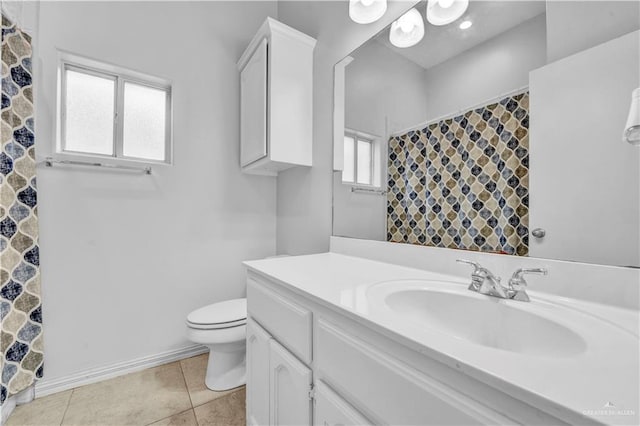 bathroom with vanity, tile patterned floors, and toilet