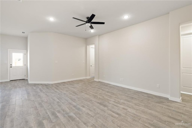 empty room featuring ceiling fan and light wood-type flooring