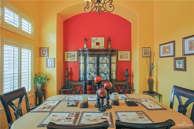 dining space with an inviting chandelier