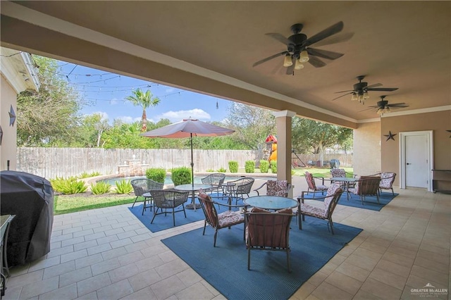 view of patio with grilling area and ceiling fan