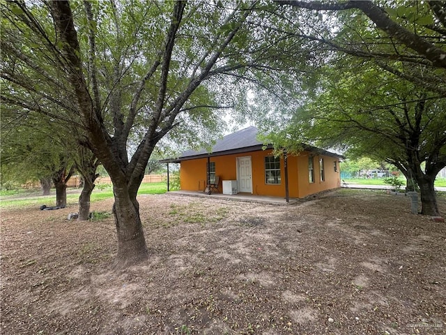 view of side of property featuring ac unit