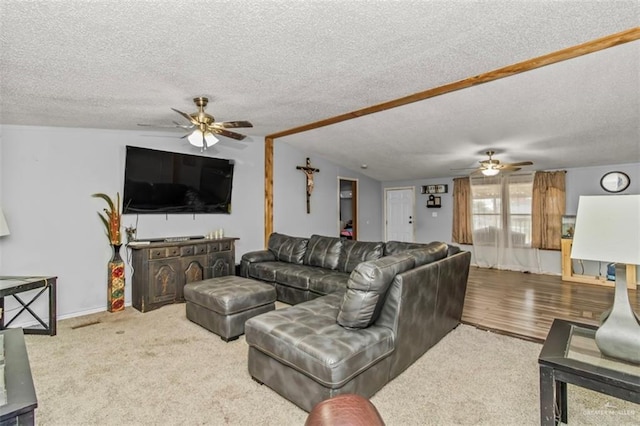 living room featuring lofted ceiling, ceiling fan, a textured ceiling, and hardwood / wood-style flooring