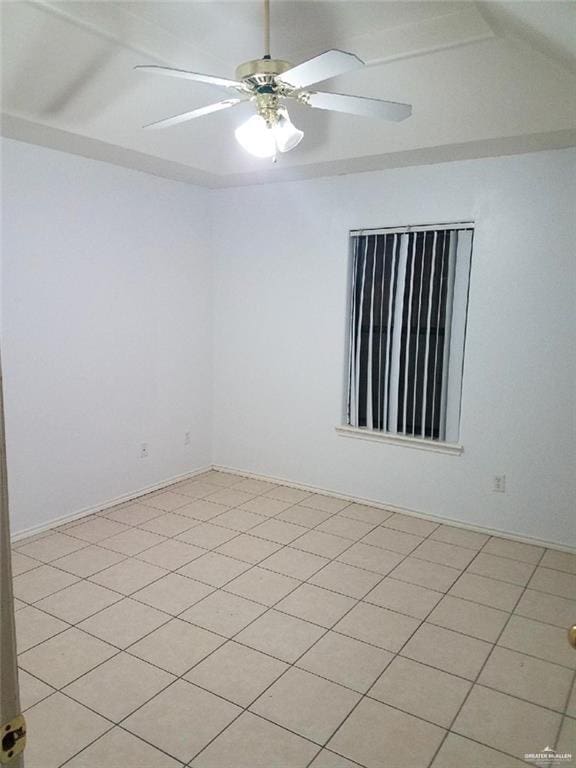 unfurnished room with ceiling fan and light tile patterned floors