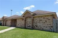 ranch-style home with a front yard