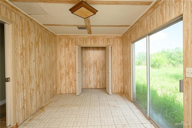 15220 Wilson Rd, Harlingen, TX 78552 - spare room with wood walls and brick patterned floors