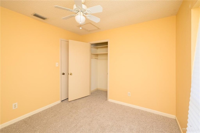 15220 Wilson Rd, Harlingen, TX 78552 - unfurnished bedroom with light colored carpet, a closet, ceiling fan, and a textured ceiling
