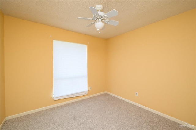15220 Wilson Rd, Harlingen, TX 78552 - spare room featuring carpet, a ceiling fan, and a textured ceiling