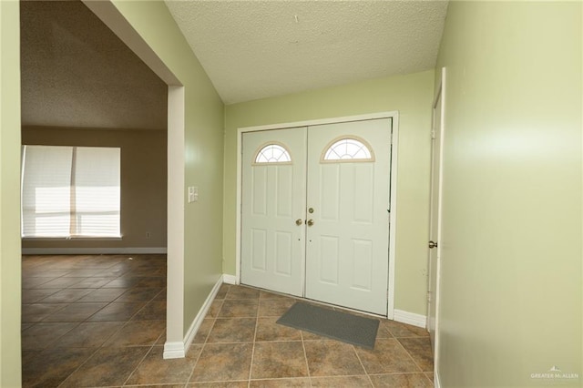 15220 Wilson Rd, Harlingen, TX 78552 - entrance foyer featuring baseboards and a textured ceiling