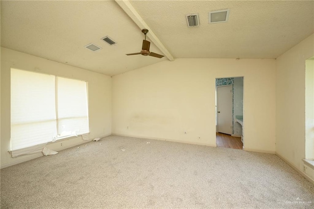 15220 Wilson Rd, Harlingen, TX 78552 - carpeted spare room featuring ceiling fan, lofted ceiling, and a textured ceiling
