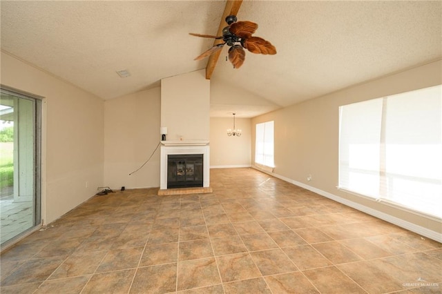 15220 Wilson Rd, Harlingen, TX 78552 - unfurnished living room with a glass covered fireplace, ceiling fan, a chandelier, and a textured ceiling