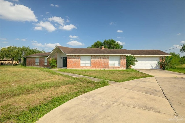 15220 Wilson Rd, Harlingen, TX 78552 - ranch-style house featuring concrete driveway, a front yard, an attached garage, and brick siding
