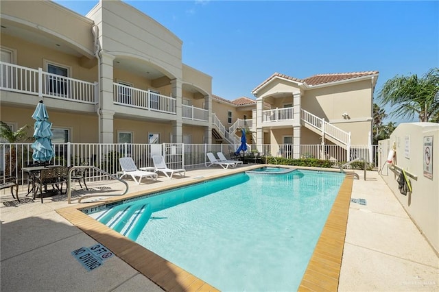 view of pool featuring a patio