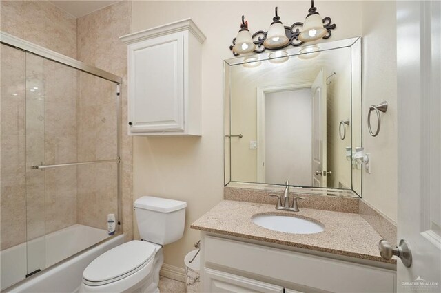 109 W Cora Lee Dr Unit 9, South Padre Island, TX 78597 - full bathroom featuring vanity, toilet, and combined bath / shower with glass door
