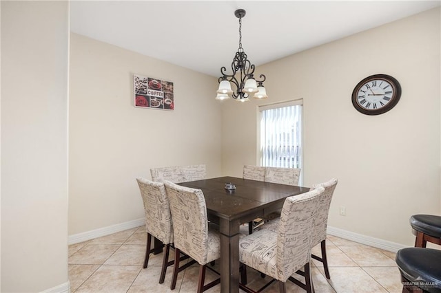 tiled dining space with a notable chandelier