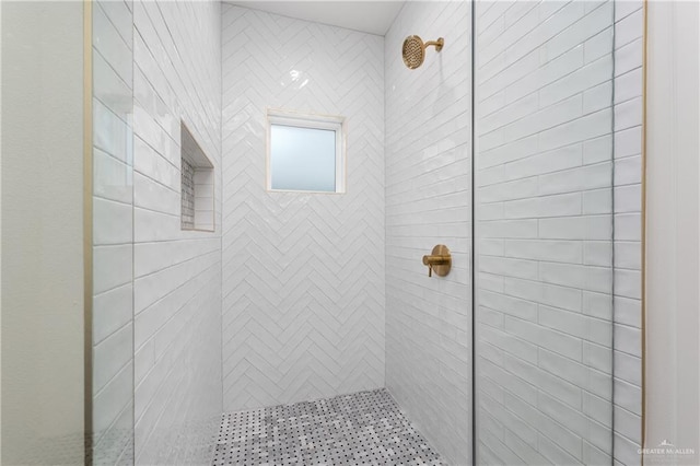 bathroom with a tile shower