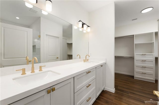 bathroom with hardwood / wood-style flooring and vanity