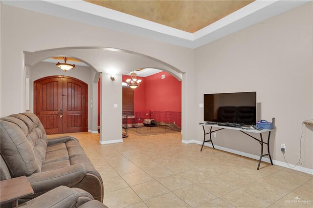 1617 N Monmack Rd, Edinburg, TX 78541 - tiled living area with arched walkways and a chandelier