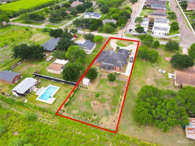 1617 N Monmack Rd, Edinburg, TX 78541 - aerial perspective of suburban area featuring a pool area and property parcel outlined