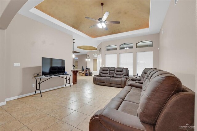 1617 N Monmack Rd, Edinburg, TX 78541 - living area featuring a raised ceiling, ceiling fan, and light tile patterned floors