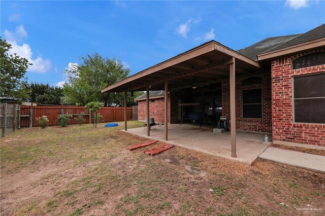 1617 N Monmack Rd, Edinburg, TX 78541 - fenced backyard featuring a patio area and ceiling fan