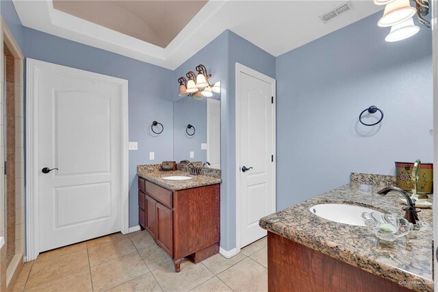 1617 N Monmack Rd, Edinburg, TX 78541 - bathroom with two vanities and tile patterned floors