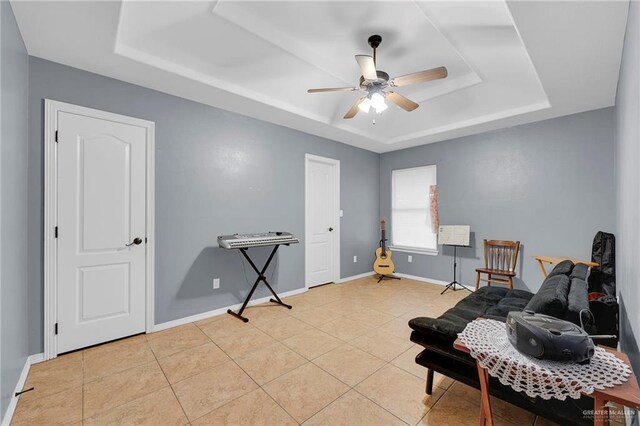 1617 N Monmack Rd, Edinburg, TX 78541 - sitting room with a tray ceiling, a ceiling fan, and tile patterned flooring
