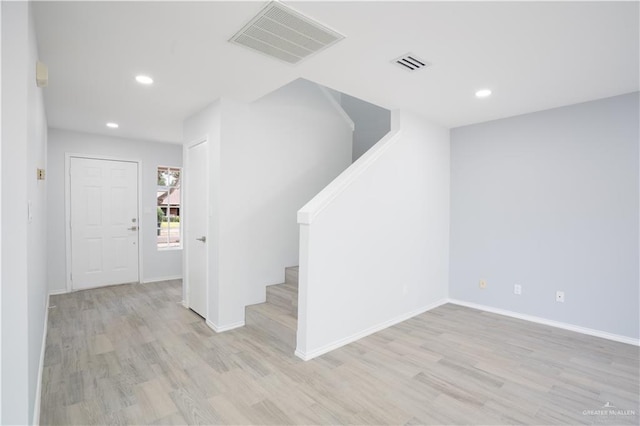 stairway featuring hardwood / wood-style floors