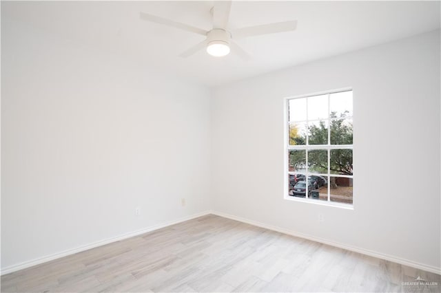 spare room with ceiling fan and light hardwood / wood-style flooring